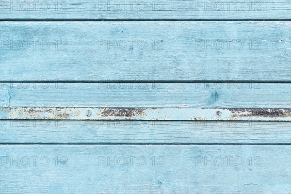 Light blue wooden background with horizontal old planks