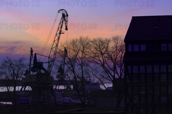 Silhouettes of port crane