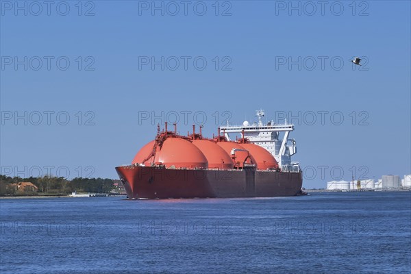 LNG or liquified natural gas tanker entering port on a sunny day in Klaipeda