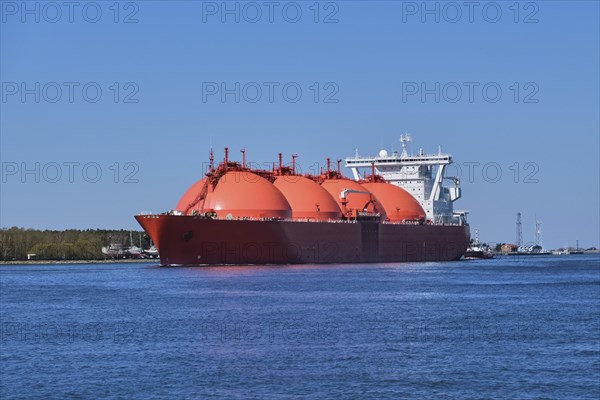 LNG or liquified natural gas tanker entering port on a sunny day in Klaipeda