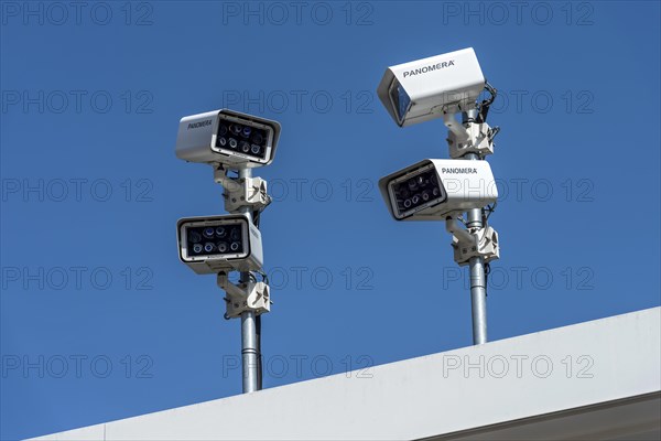 Surveillance cameras on rooftops