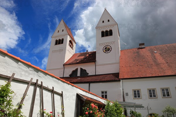 West façade with porch and monastery garden