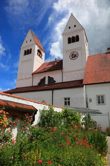 West façade with porch and monastery garden