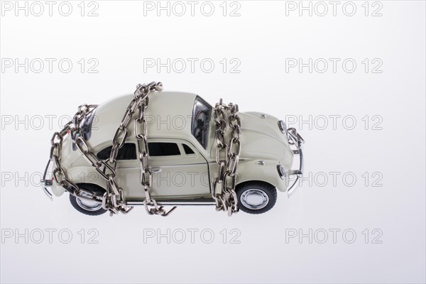 Chained white car on white background