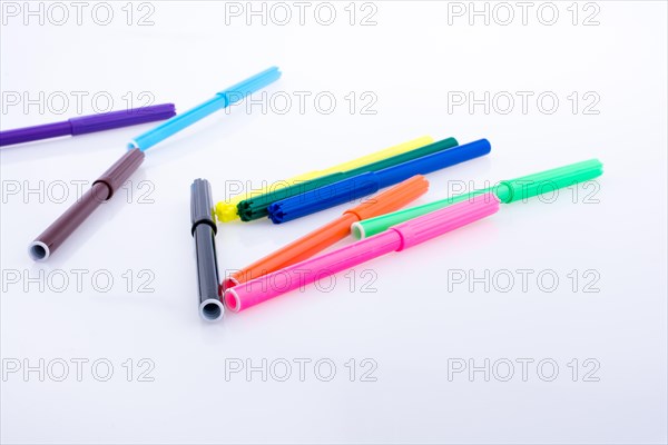 Color felt-tip pens of various color on white background