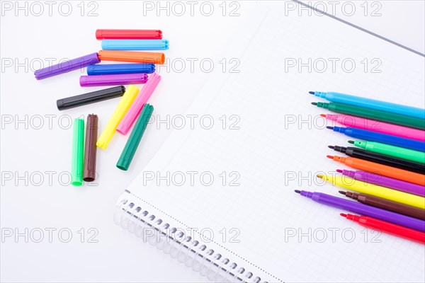 Colorful felt-tip pens on a notebook