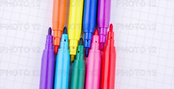 Colorful felt-tip pens on a notebook