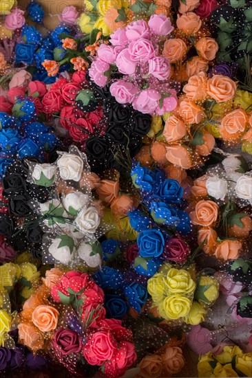 Plastic unreal fake flowers colourful flowers