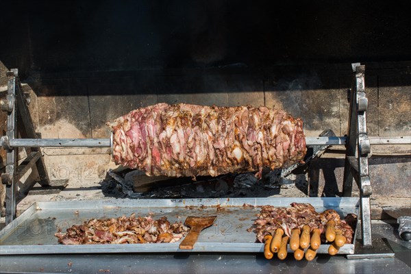 Turkish cag Kebab on pole in horizontal position