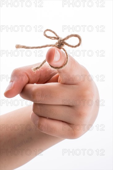 Hand tied with a thread like a ribbon on a white background