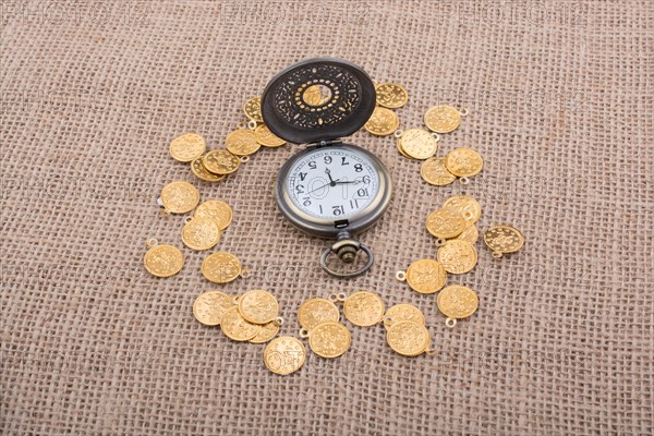 Retro styled pocket watch with fake gold coins around