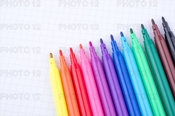 Colorful felt-tip pens on a notebook