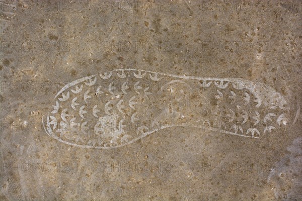 Footstep pattern seen on a concrete background