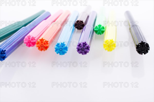 Color felt-tip pens of various color on white background