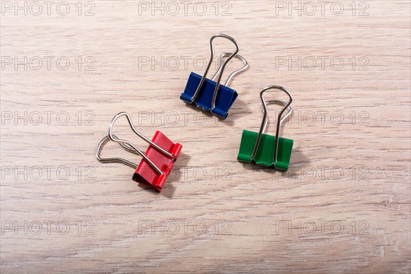 Picture of metallic binder clips with handles in view