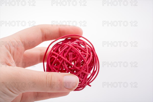 Roll of colotful string in the hand