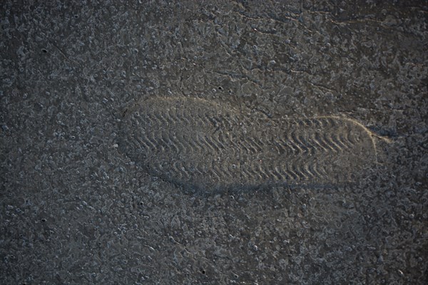 Footstep pattern seen on a concrete background