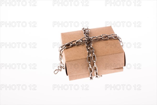Cardboard Box in chains on a white background