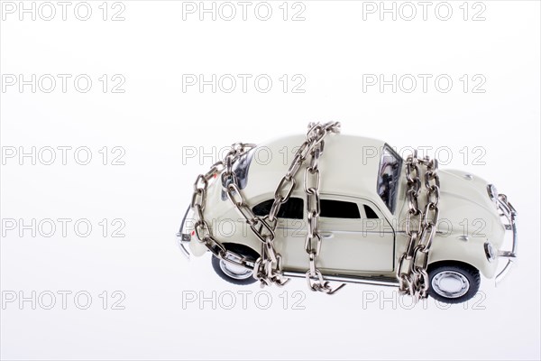 Chained white car on white background