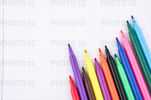 Colorful felt-tip pens on a notebook