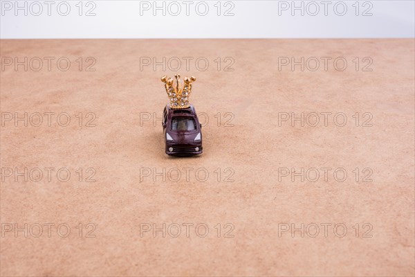 Golden color crown model and a model car