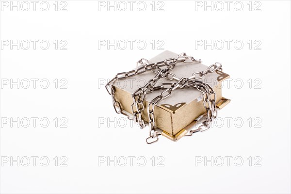 Chained book on white background