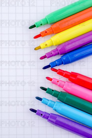 Colorful felt-tip pens on a notebook