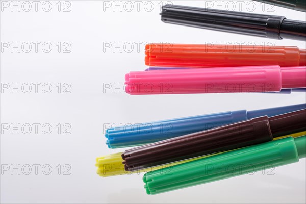 Color felt-tip pens of various color on white background