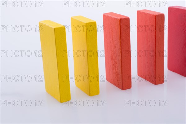 Colorful Domino Blocks in a line on a white background