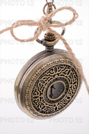 Retro style pocket watch on white background