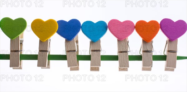 Colorful clothespin attached attached on a line side by side