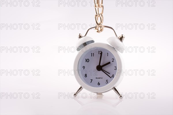 White color alarm clock on white background