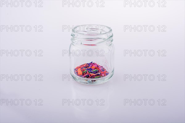 Little perfume glass bottle on a white background