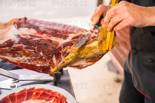 Iberian ham cutter man