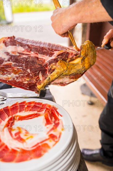 Iberian ham cutter man