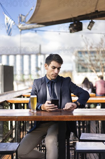 Businessman watching the time while waiting for a person