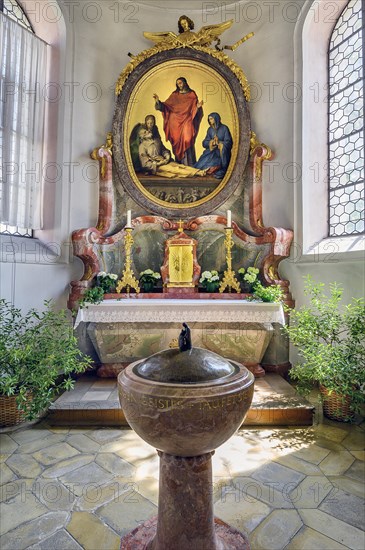 Side altar and baptismal font