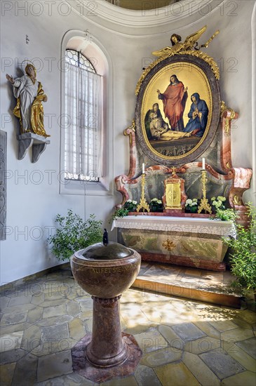 Side altar and baptismal font