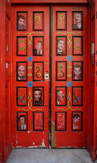 Front door painted with tango motifs in Buenos Aires