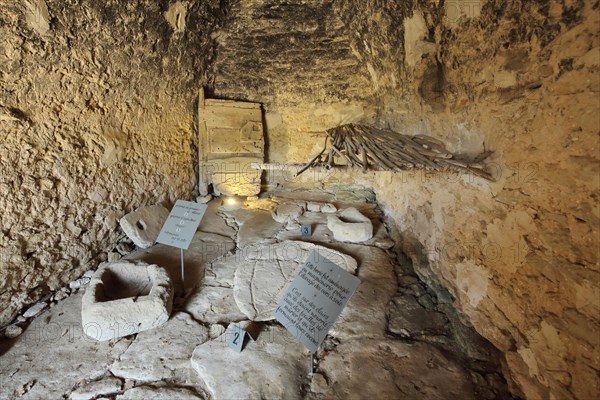 Interior view of a historic stone hut in the Village des Bories