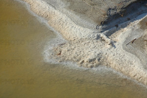 Salt deposit on the bank of the water