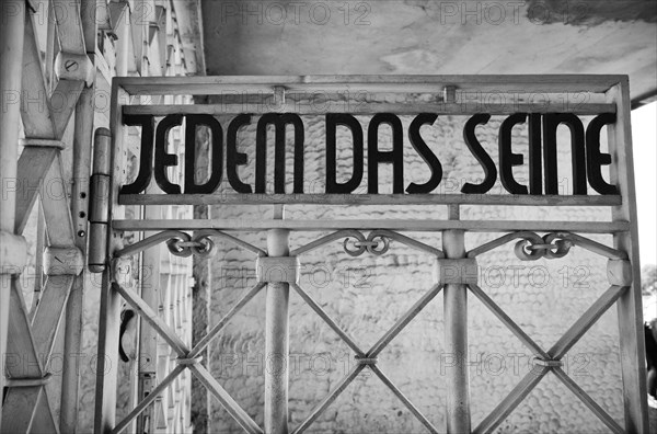 Entrance gate to beech forest concentration camp with the saying JEDEM DAS SEINE in Bauhaus script by Franz Ehrlich