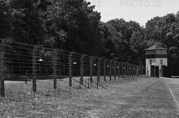 Reconstructed camp fence with watchtower