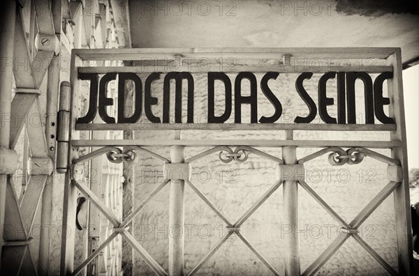 Entrance gate to beech forest concentration camp with the saying JEDEM DAS SEINE in Bauhaus script by Franz Ehrlich