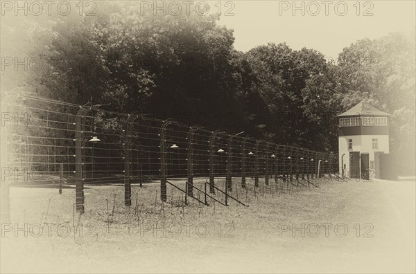 Reconstructed camp fence with watchtower