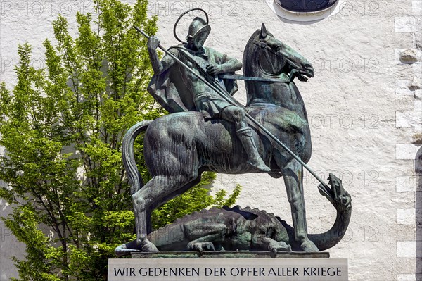 War memorial and George the dragon slayer at the Holy Trinity parish church in Sulzberg