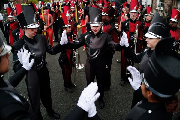 American musicians warm up before the parade on a cold St Patrick's Day in 2023