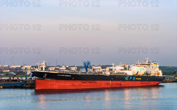 Sunrise over Gas tankers and Esso Oil Terminal