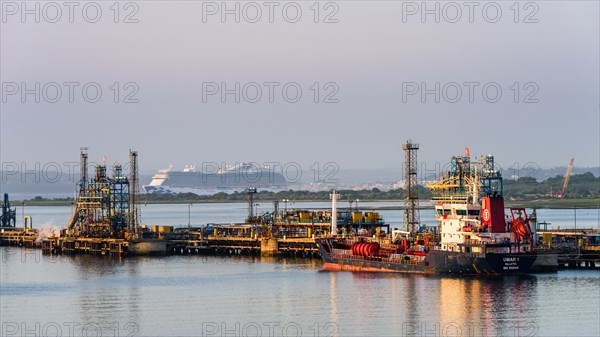 Sunrise over Gas tankers and Esso Oil Terminal