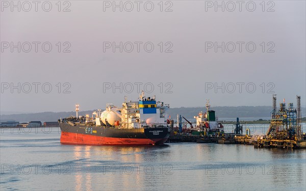 Sunrise over Gas tankers and Esso Oil Terminal